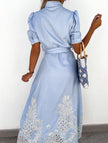 White FJØRNA pastoral style openwork embroidered dress with intricate embroidery and flowing fabric, perfect for elegant occasions.