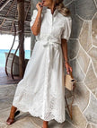 White FJØRNA pastoral style openwork embroidered dress with delicate detailing and flowing silhouette.
