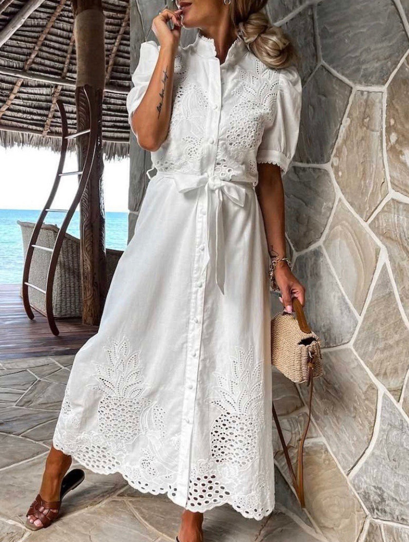White FJØRNA pastoral style openwork embroidered dress with delicate detailing and flowing silhouette.