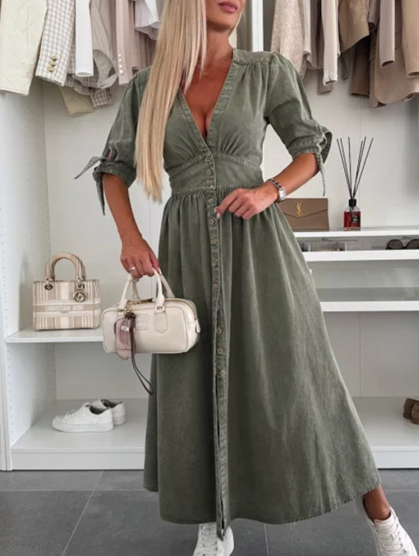 FJØRNA white fitted deep V-neck shirt dress displayed on a hanger, showcasing its sleek, tailored design and clean lines.