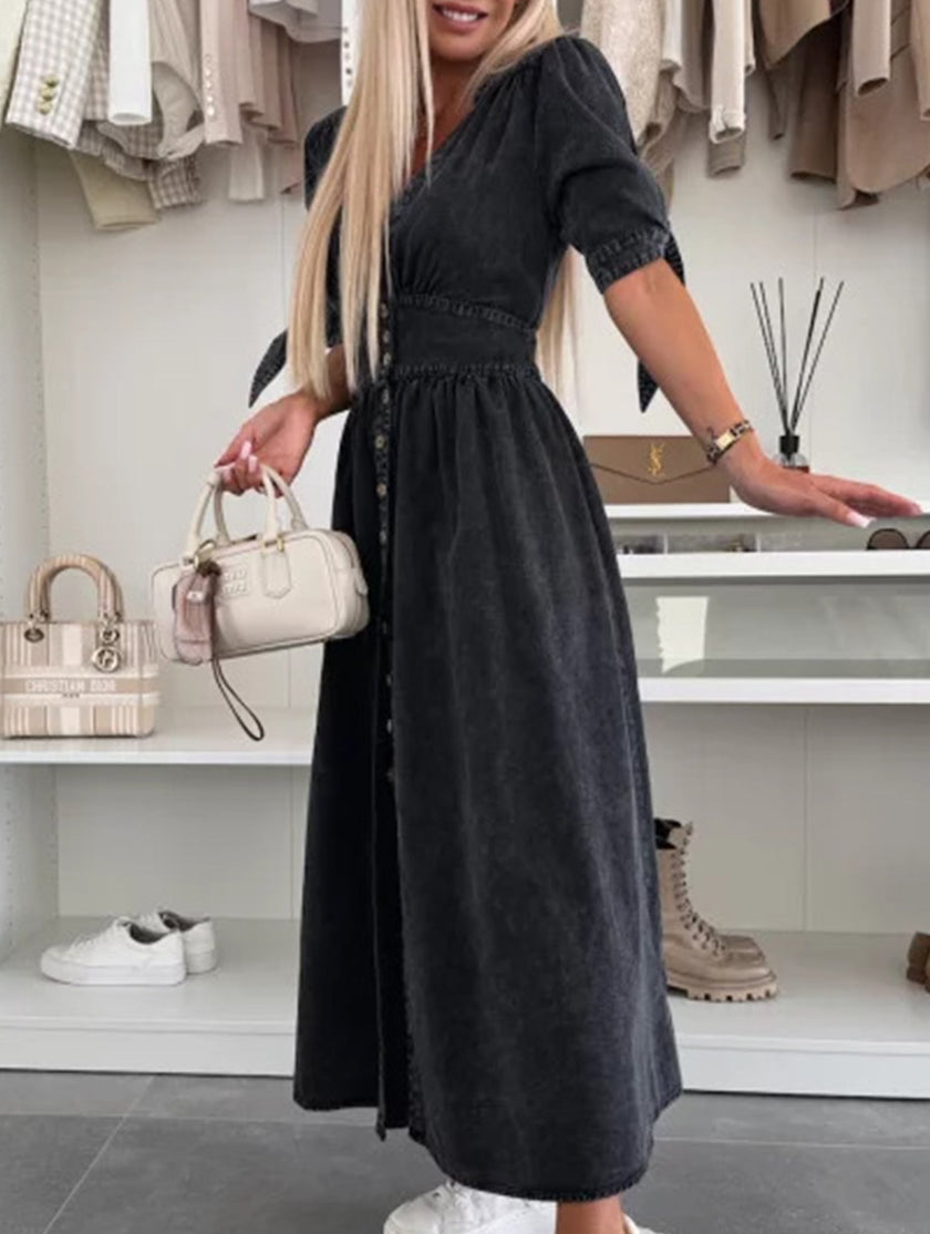Black FJØRNA deep V-neck fitted shirt dress, stylish and elegant, shown on a model with a tailored silhouette.