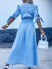 Blue FJØRNA deep V-neck fitted shirt dress with long sleeves and tailored silhouette, perfect for stylish casual wear.