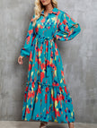 Blue printed tie-waist lantern sleeve dress by FJØRNA, featuring a stylish silhouette and elegant design.