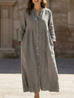 FJØRNA white cotton linen maxi dress with buttons, full-length design, flowing fabric, and a relaxed fit.