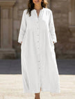 White FJØRNA cotton linen maxi dress with solid color, button details, flowing design, and sleeveless style.