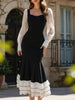 Black colorblock long sleeve mermaid dress by FJØRNA featuring fitted silhouette and elegant design.