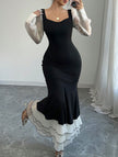 Black colorblock long sleeve mermaid dress by FJØRNA featuring fitted silhouette and elegant design.