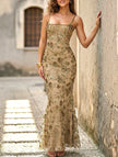 White backless maxi dress with a low neckline and tie details from FJØRNA, perfect for elegant occasions.