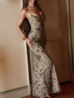 White FJØRNA low neck backless tie maxi dress, elegant sleeveless design with flowing fabric and stylish backless detail.
