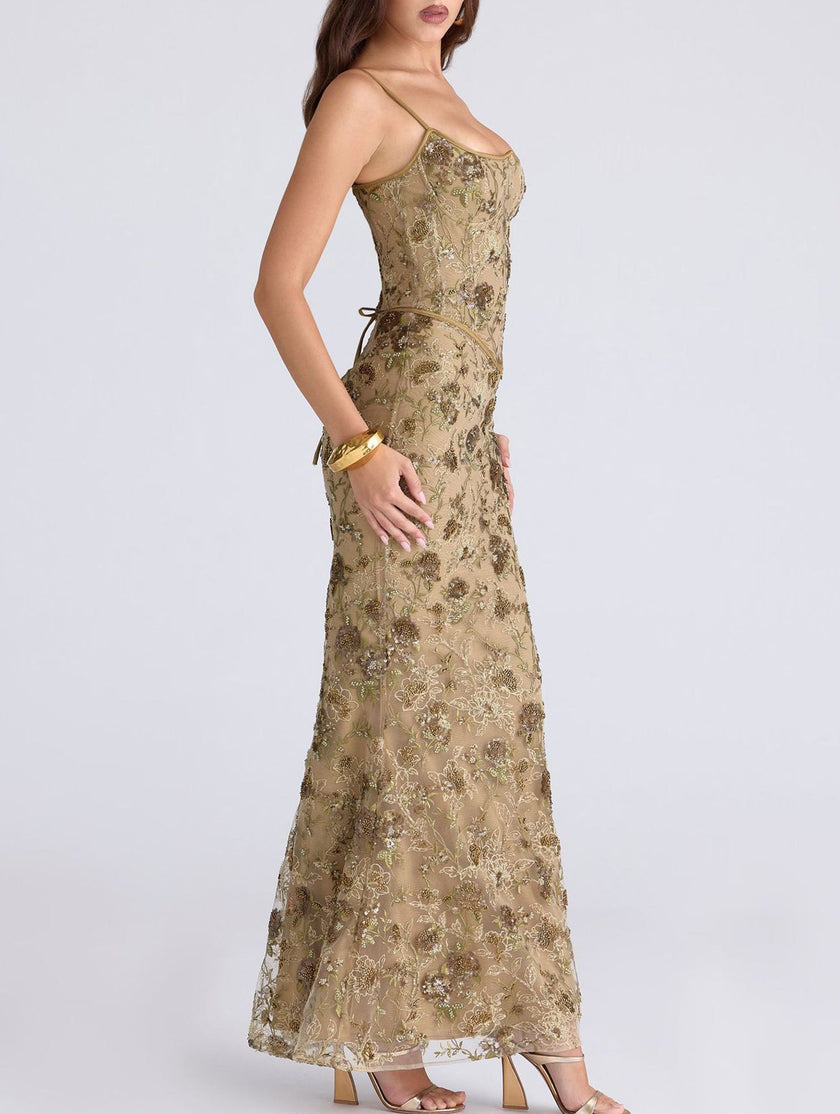 FJØRNA white backless maxi dress with a low neckline and tie detail, elegant and flowing for formal occasions or summer events.