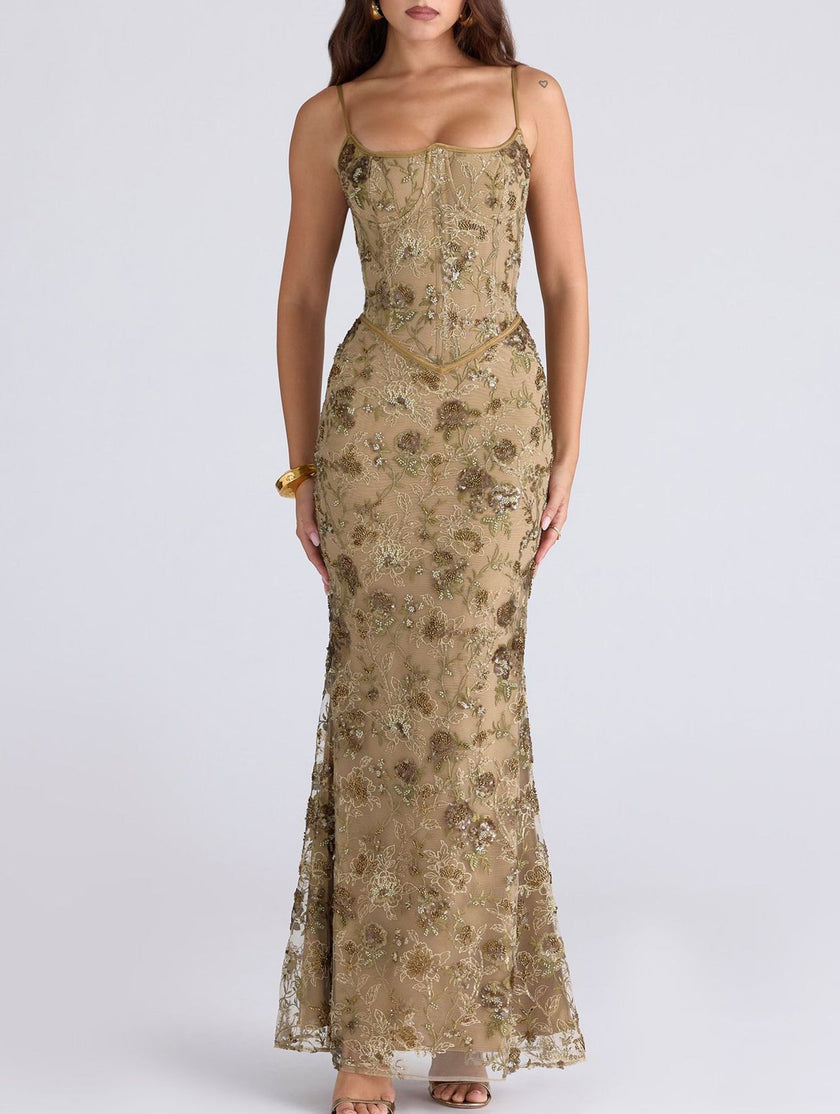 White low neck backless tie maxi dress by FJØRNA with elegant flowing fabric and stylish design for formal occasions.