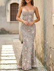 Gray backless tie maxi dress by FJØRNA featuring a low neckline and elegant flowing design, perfect for formal occasions.