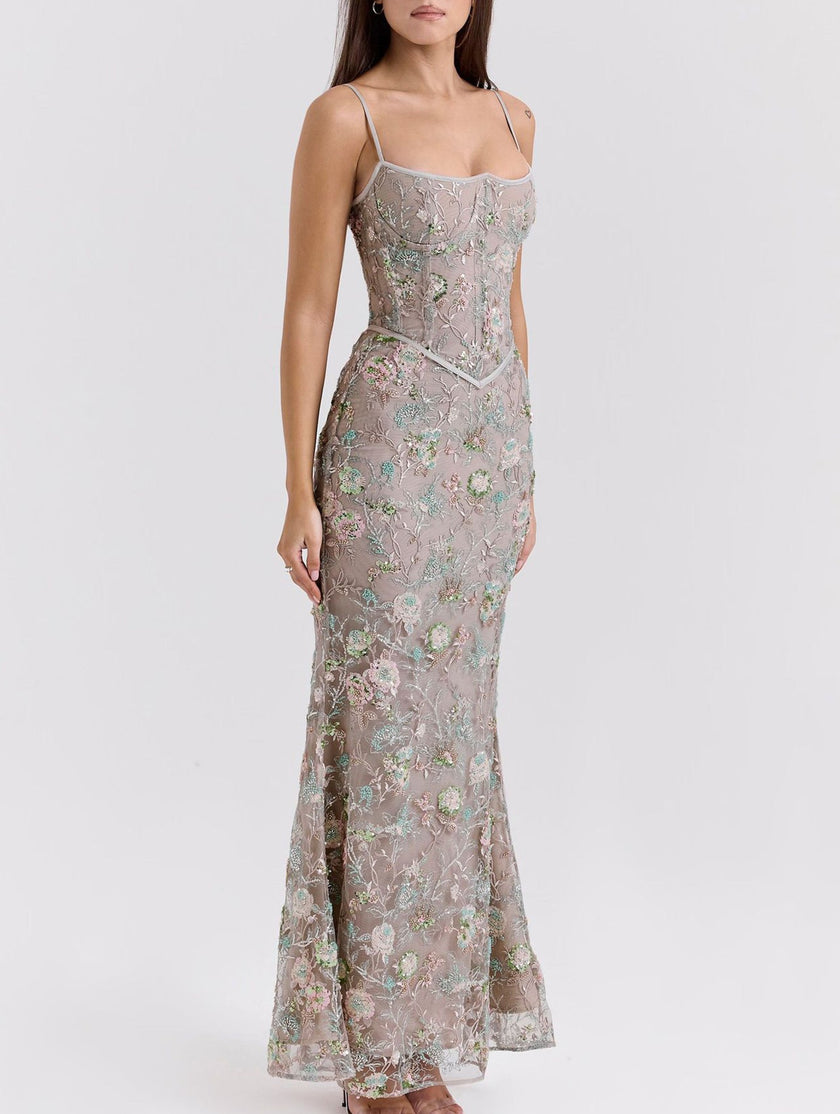 FJØRNA white backless maxi dress with low neckline and tie detail, elegant flowy design perfect for formal occasions.