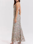FJØRNA white backless maxi dress with a low neckline and elegant tie detail, perfect for formal occasions.
