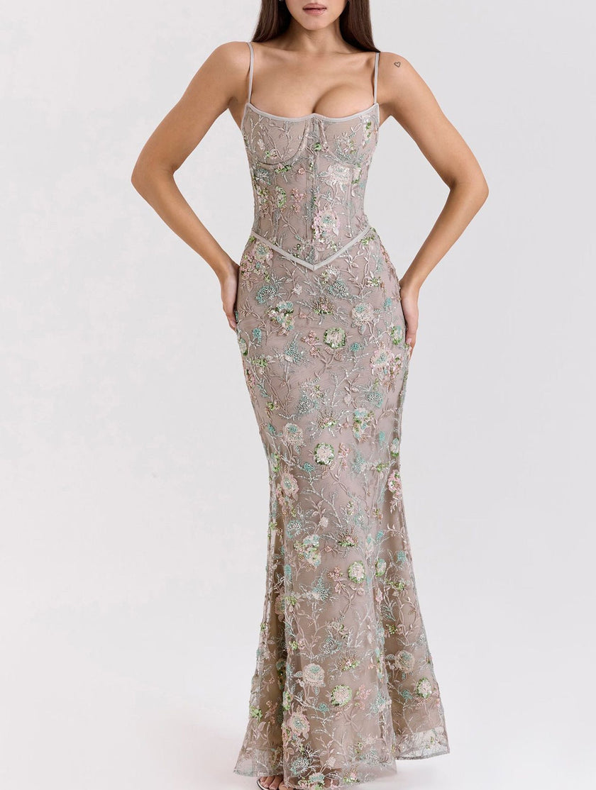 Backless white maxi dress by FJØRNA featuring a low neckline and elegant tie details, perfect for formal occasions.
