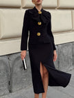 Black FJØRNA V-neck dress with bow waist-cinching design, elegant style, and flattering fit.