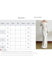 FJØRNA French-style elegant slim-fit white dress, showcasing a sleek fit and stylish design on a model.