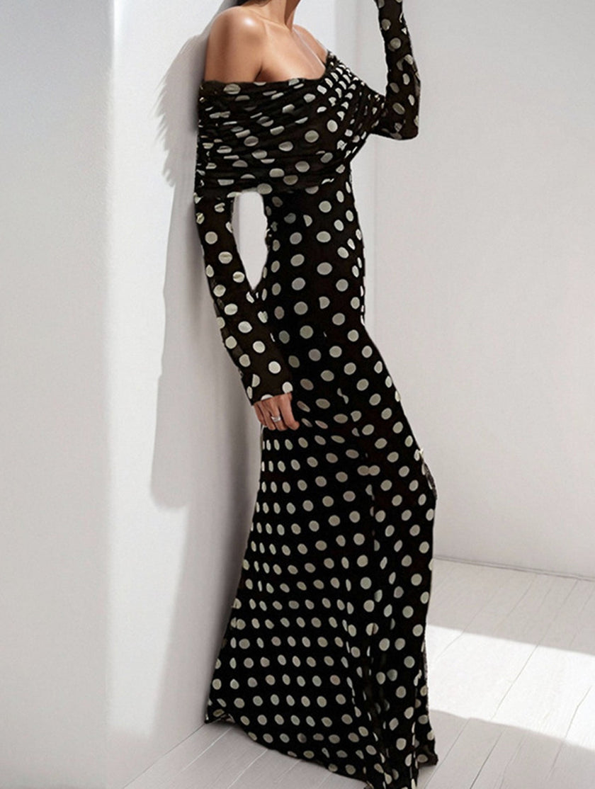 Elegant white polka dot dress by FJØRNA featuring a sexy and sophisticated design, ideal for stylish occasions.