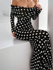 Black polka dot elegant dress by FJØRNA featuring a stylish design, perfect for sophisticated occasions.