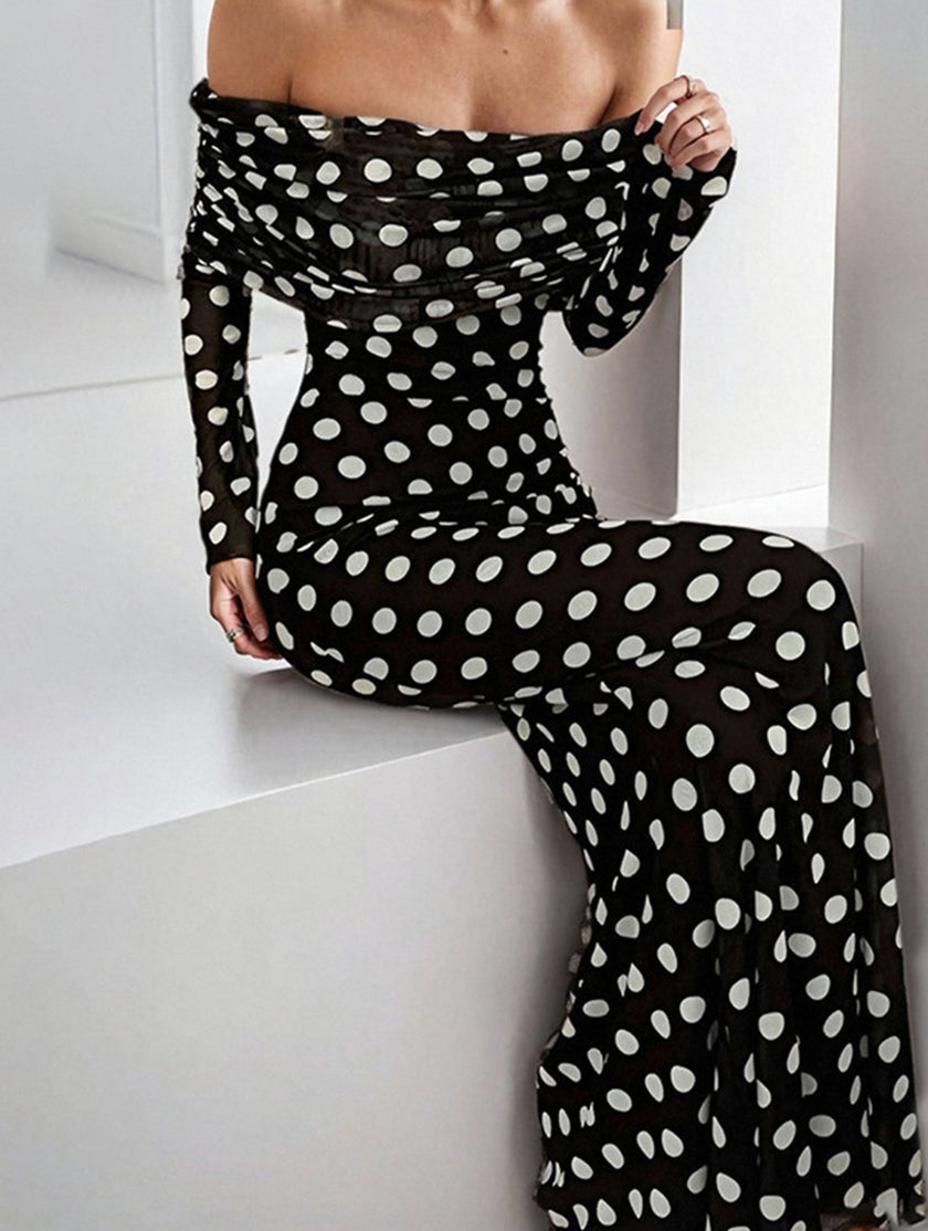 Black polka dot elegant dress by FJØRNA featuring a stylish design, perfect for sophisticated occasions.