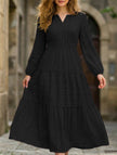 FJØRNA white V-neck tiered puff sleeve maxi dress with flowing fabric, elegant design, and layered skirt.