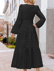 White V-neck tiered puff sleeve maxi dress by FJØRNA, flowing design with layered fabric and elegant silhouette.