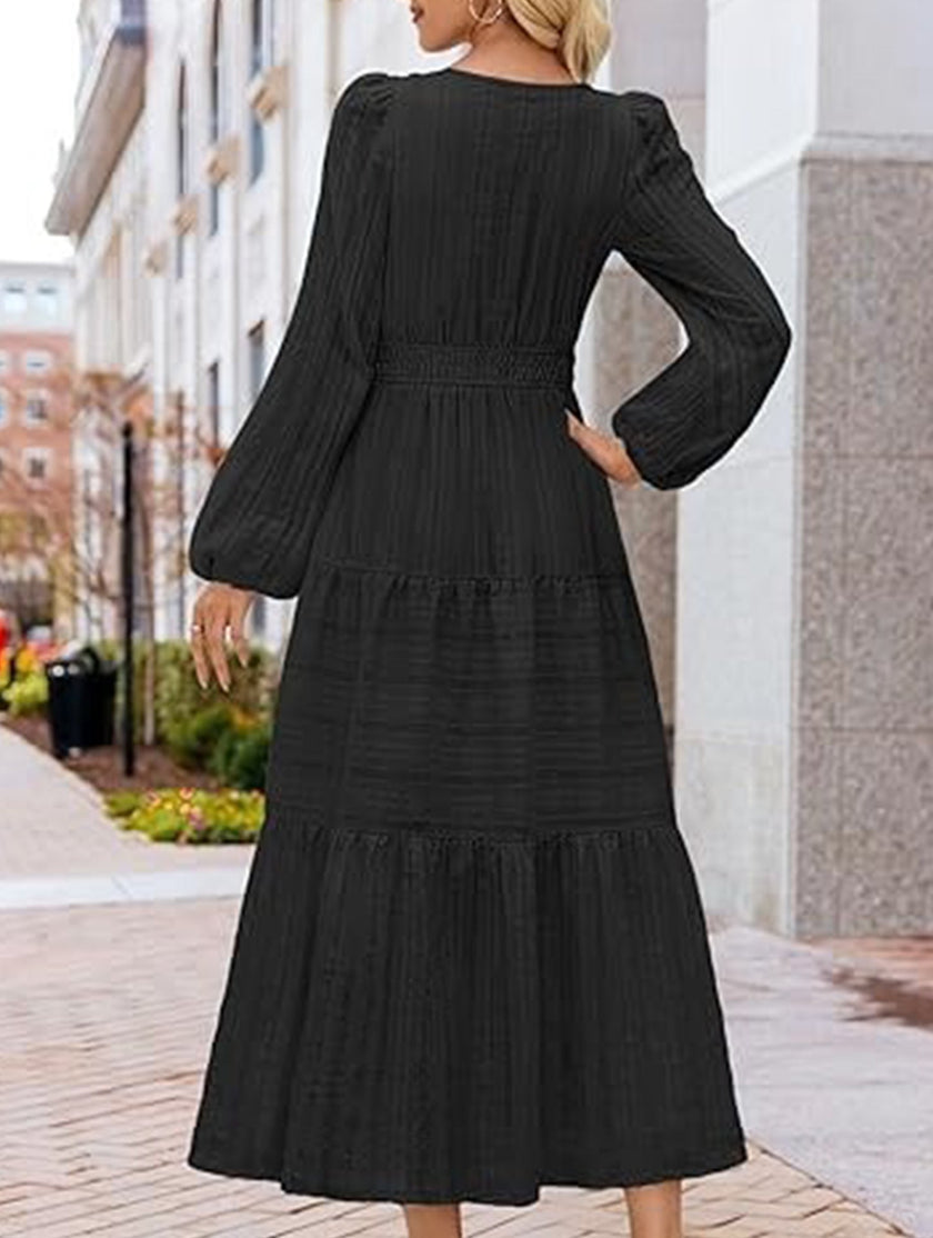 White V-neck tiered puff sleeve maxi dress by FJØRNA, flowing design with layered fabric and elegant silhouette.