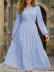 Light blue V-neck tiered puff sleeve maxi dress by FJØRNA, flowing design with layered tiers and puffed sleeves.