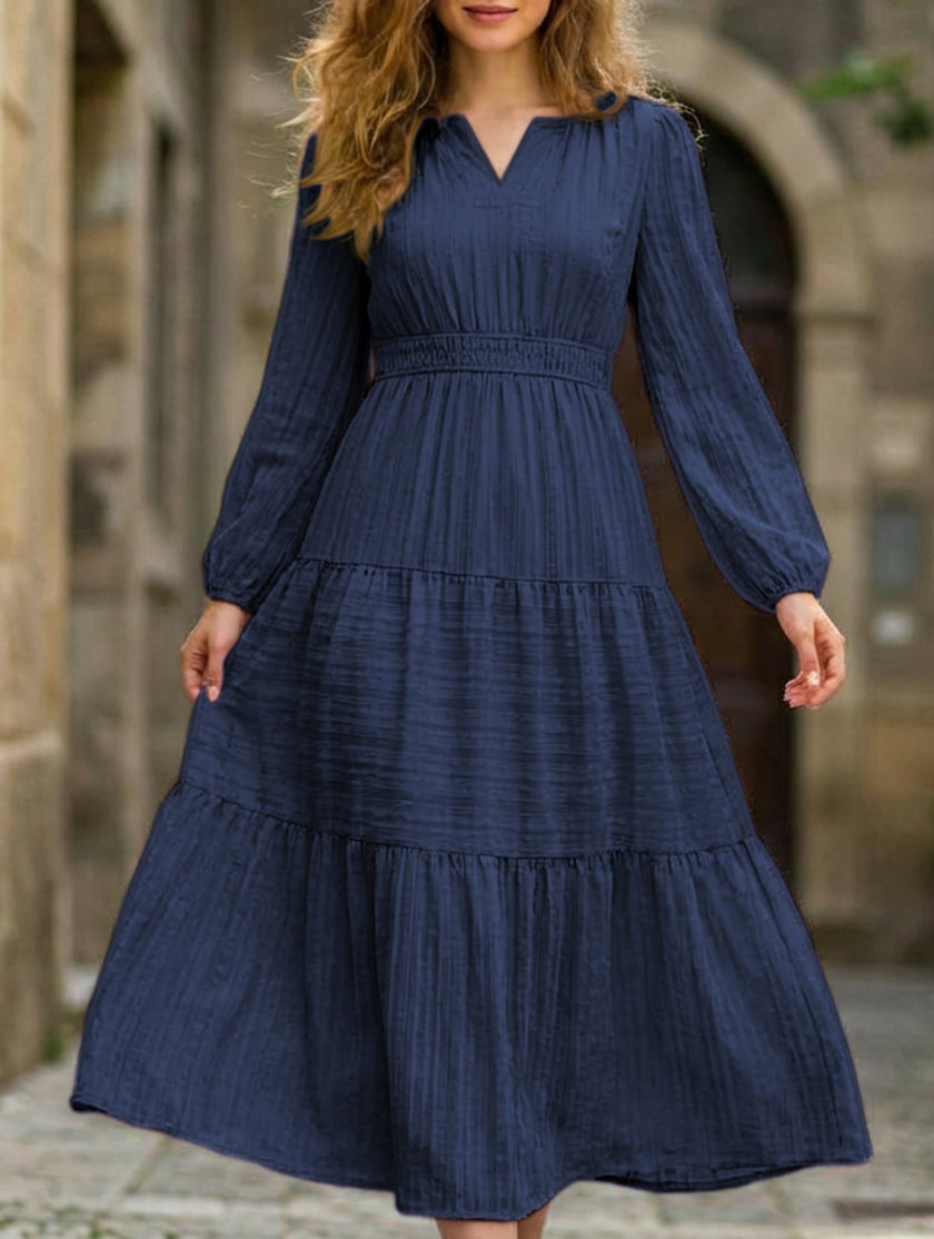 White V-neck tiered puff sleeve maxi dress by FJØRNA featuring flowing fabric and a stylish, elegant design.