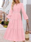 White V-neck tiered maxi dress with puff sleeves by FJØRNA, featuring flowing fabric and elegant design.