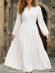 White V-neck tiered puff sleeve maxi dress by FJØRNA, flowing fabric with layered skirt and elegant design.