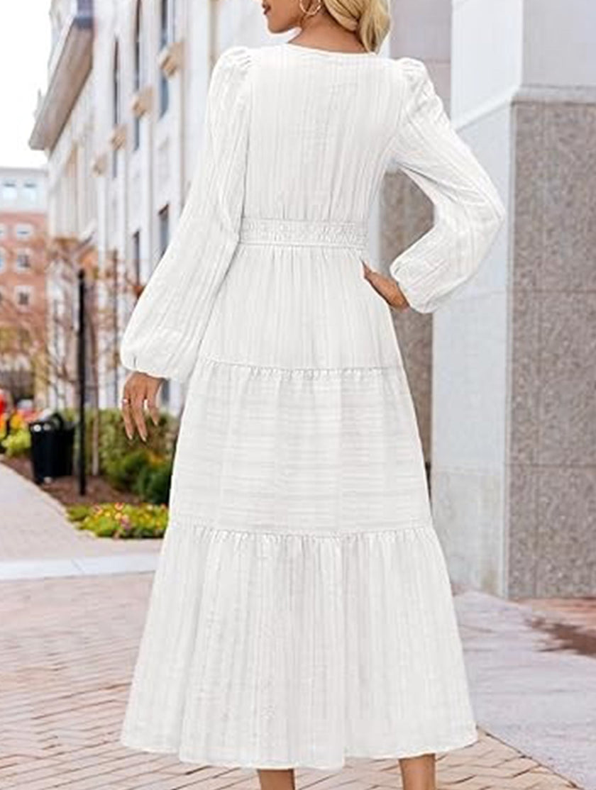 White V neck tiered puff sleeve maxi dress by FJØRNA, featuring flowing fabric and layered design, perfect for elegant summer occasions.