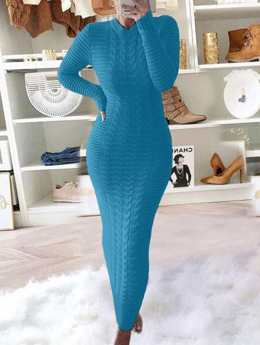 Blue FJØRNA cable knit wool dress with long sleeves, stylish and cozy for winter wear.