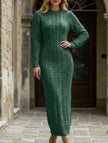 FJØRNA white cable knit long-sleeved wool dress displayed on a hanger with detailed knit pattern and classic silhouette.