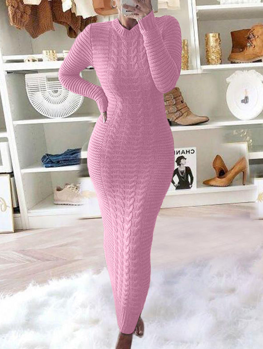 FJØRNA cable knit long-sleeve wool dress in white, featuring a cozy, fashionable design with a textured knit pattern.