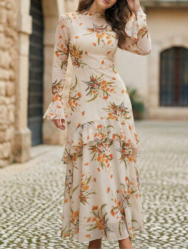 Women's white dress by FJØRNA with lotus leaf sleeves and floral print, showcasing elegant design and fabric details.