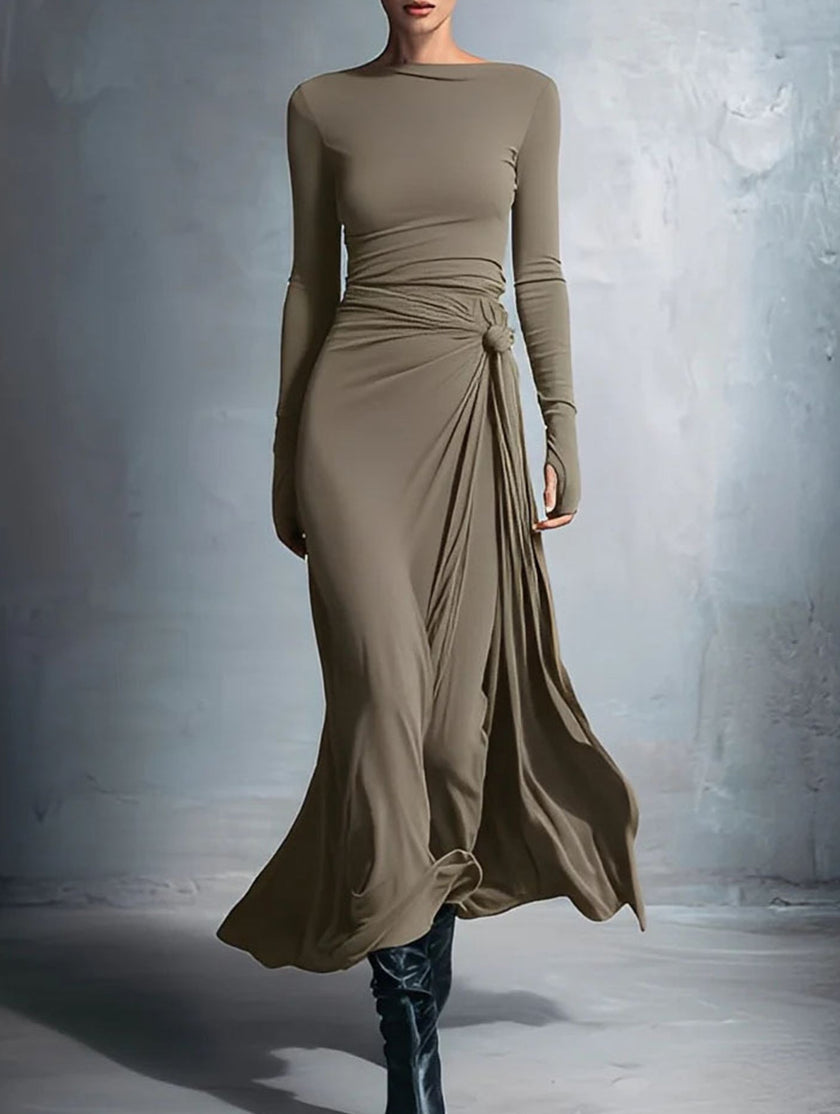 White FJØRNA solid wrap-style knot long sleeve dress displayed on a model. Elegant, casual dress ideal for various occasions.