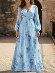 FJØRNA V neck pleated printed white maxi dress with slim fit and flowing design, shown in blue color with a stylish silhouette.