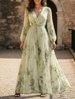 Yellow V neck pleated printed slim maxi dress by FJØRNA, styled with flowing fabric and elegant design for a chic look.