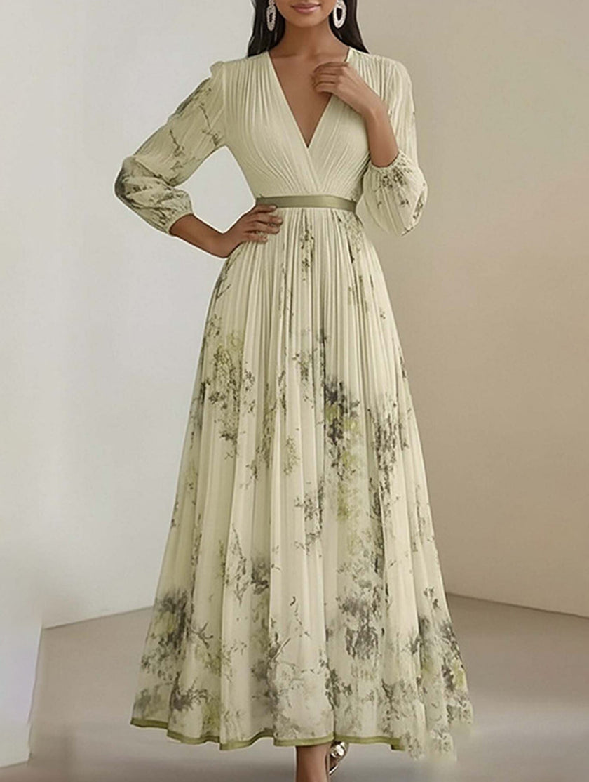 Yellow V-neck pleated printed slim maxi dress by FJØRNA, flowing white dress with elegant pleats and vibrant pattern.