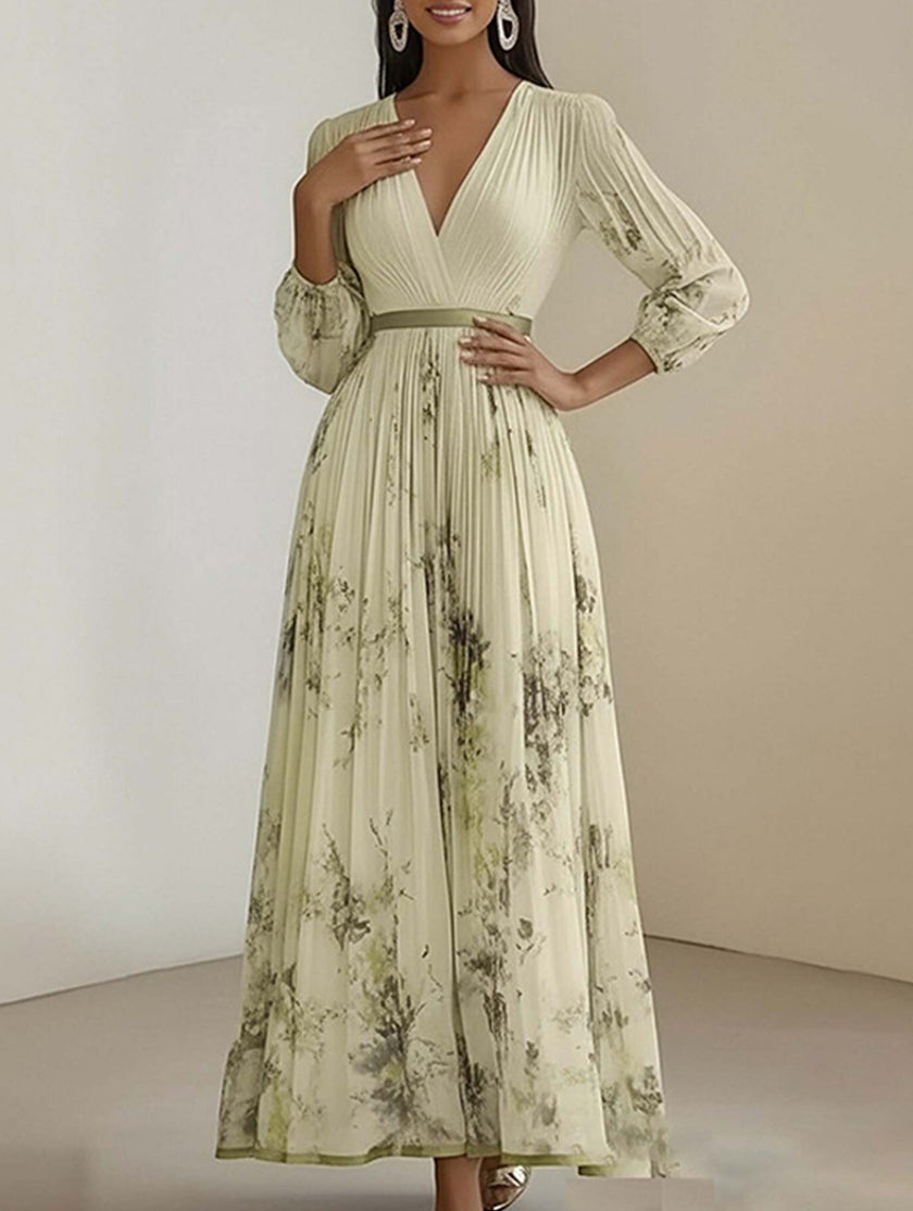 FJØRNA white V-neck pleated printed maxi dress with slim silhouette and flowing design, shown in a stylish yellow variant.