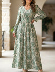 FJØRNA women's printed V-neck full skirt dress in white, featuring a colorful floral pattern and flowing silhouette.