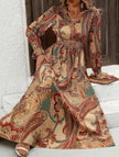 Women's printed V-neck full skirt dress by FJØRNA in white with khaki pattern, flowing fabric and elegant design.