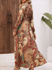 Women's white printed V-neck full skirt dress by FJØRNA, featuring a stylish design and flowing silhouette.