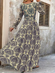 FJØRNA vintage print white V-neck long sleeve maxi dress with elegant flowing fabric and classic design.