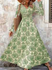 FJØRNA vintage print white V-neck long sleeve maxi dress with elegant flowy design and intricate pattern.