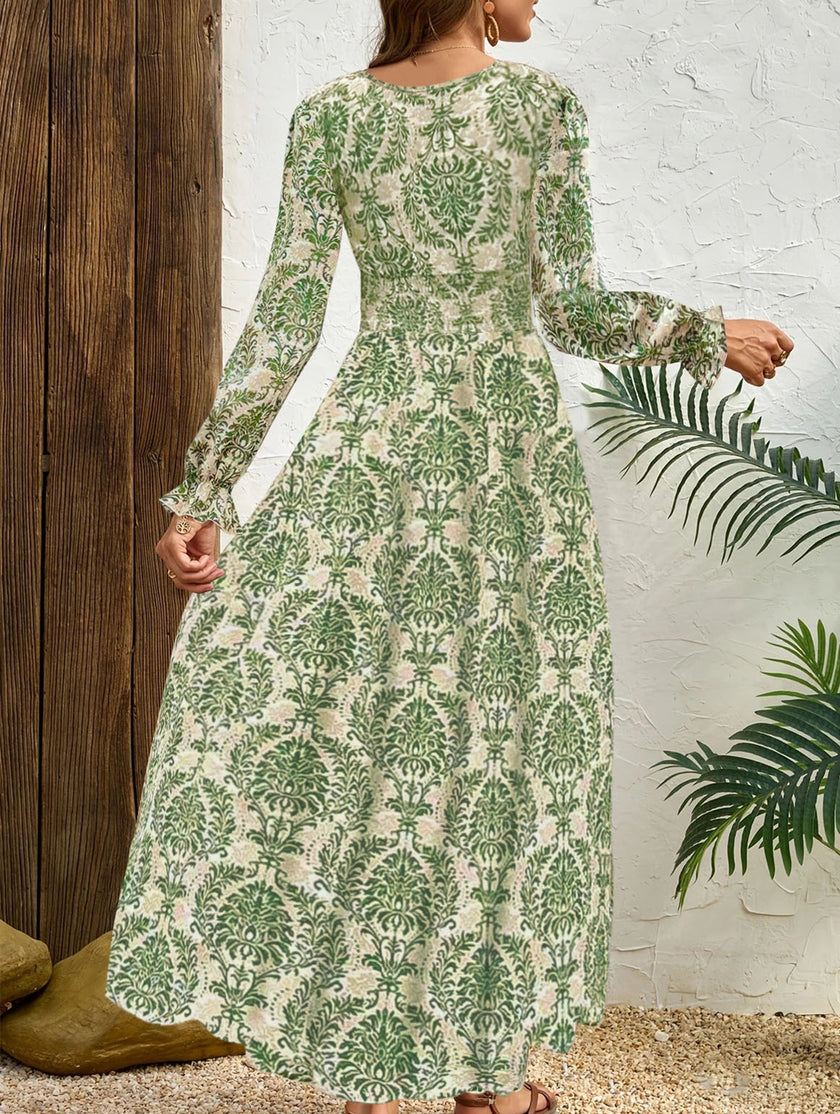 FJØRNA vintage print white V-neck long sleeve maxi dress with floral pattern, flowing fabric, and elegant design.