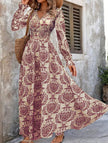 FJØRNA vintage print white V-neck long sleeve maxi dress with elegant flowy fabric and classic silhouette.