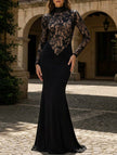 Black lace hollow mock neck bodycon dress by FJØRNA, featuring a fitted silhouette and intricate lace detailing.