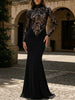 Black lace hollow mock neck bodycon dress by FJØRNA, featuring a fitted silhouette and intricate lace detailing.